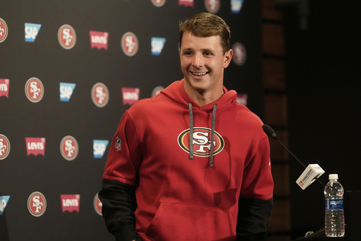 San Francisco 49ers quarterback Brock Purdy smiles after speaking during a news conference at the NFL football team's facility, Wednesday, May 21, 2025, in Santa Clara, Calif. (AP Photo/Jeff Chiu)