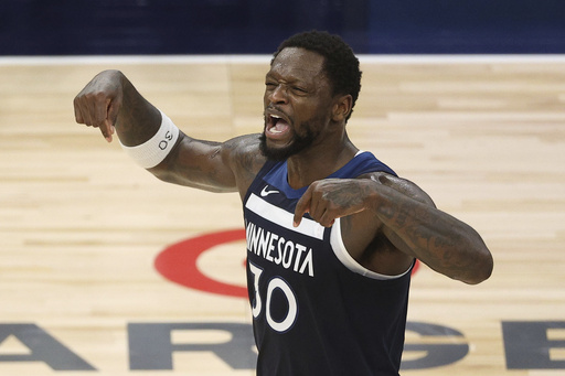 Minnesota Timberwolves forward Julius Randle (30) reacts during the second half of Game 3 of the Western Conference finals of the NBA basketball playoffs against the Oklahoma City Thunder, Saturday, May 24, 2025, in Minneapolis. (AP Photo/Matt Krohn)