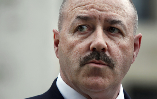 FILE - Former New York City police Commissioner Bernard Kerik stands outside the Federal Court in Washington, June 4, 2009. (AP Photo/Manuel Balce Ceneta, File)
