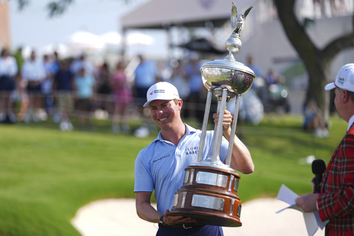 Ben Griffin celebrates after winning the Charles Schwab Challenge golf tournament at Colonial Country Club in Fort Worth, Texas, Sunday, May 25, 2025. (AP Photo/Julio Cortez)