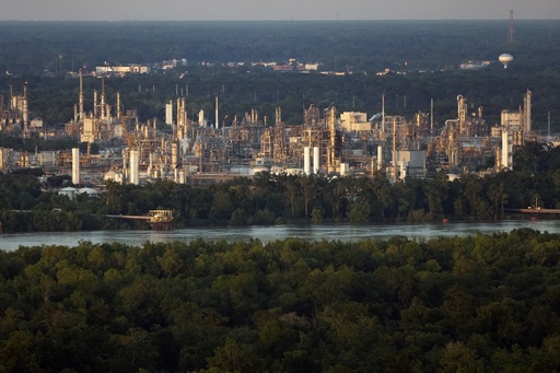 FILE - The community of Geismar is seen in the shadow of a chemical and petroleum industrial corridor, that is a known source of ethylene oxide emissions, in Ascension Parish, La., Friday, June 7, 2024. (AP Photo/Gerald Herbert, File)