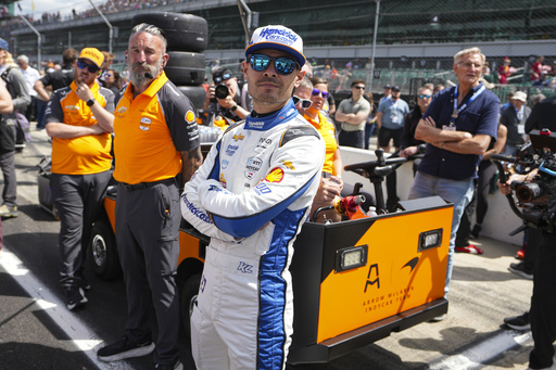Kyle Larson watches with his crew as he waits for is turn during qualification for the Indianapolis 500 auto race at Indianapolis Motor Speedway in Indianapolis, Saturday, May 17, 2025. (AP Photo/Michael Conroy)