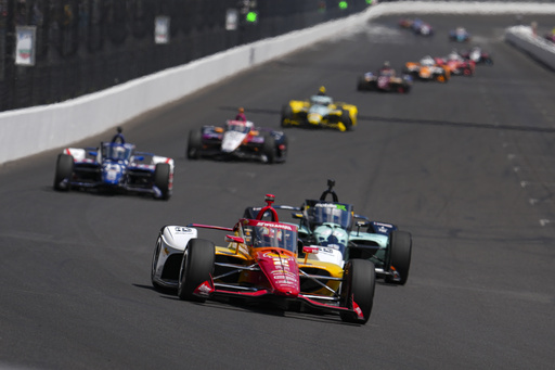 Josef Newgarden drives into the first turn during practice for the Indianapolis 500 auto race at Indianapolis Motor Speedway in Indianapolis, Friday, May 23, 2025. (AP Photo/Michael Conroy)
