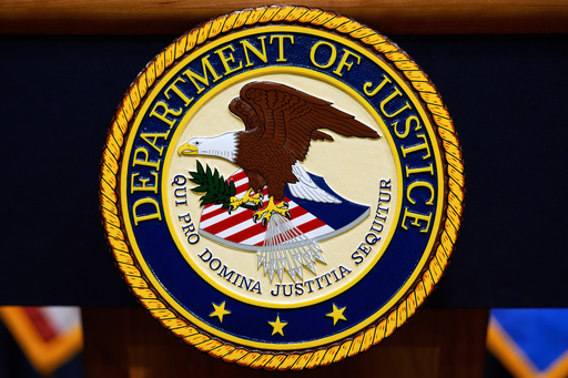 The U.S. Department of Justice logo is seen on a podium before a press conference with Attorney General Pam Bondi, Tuesday, May 6, 2025, at the Justice Department in Washington. (AP Photo/Julia Demaree Nikhinson)