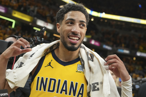 Indiana Pacers guard Tyrese Haliburton (0) celebrates the team's win after Game 4 of the Eastern Conference finals of the NBA basketball playoffs against the New York Knicks in Indianapolis, Tuesday, May 27, 2025. (AP Photo/Michael Conroy)