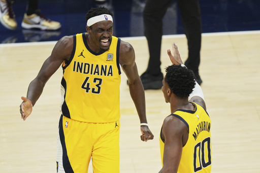 Indiana Pacers forward Pascal Siakam (43) and guard Bennedict Mathurin (00) celebrate during the second half of Game 4 of the Eastern Conference finals of the NBA basketball playoffs against the New York Knicks in Indianapolis, Tuesday, May 27, 2025. (AP Photo/AJ Mast)