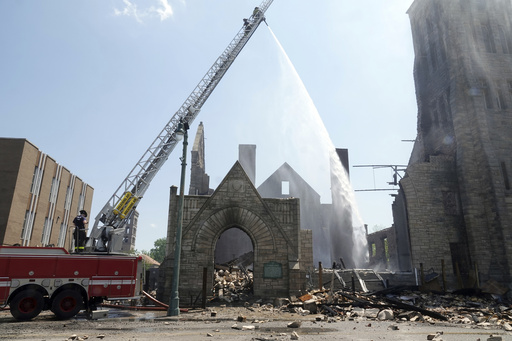 FILE - Firefighters douse the historic Clayborn Temple, a landmark from the civil rights movement with ties to Martin Luther King Jr., with water after it caught fire, April 28, 2025, in Memphis, Tenn. (AP Photo/Karen Pulfer Focht, File)