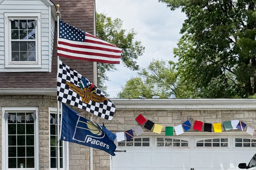 A house near the Indianapolis Motor Speedway is decked out in race gear for Sunday's Indianapolis 500 on Friday, May 23, 2025, in Indianapolis. (AP Photo/Mike Marot)