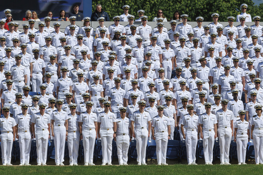 U.S. Naval Academy midshipmen stand during the academy's graduation and commissioning ceremony at the U.S. Naval Academy in Annapolis, Md., Friday, May 23, 2025. (AP Photo/KT Kanazawich)