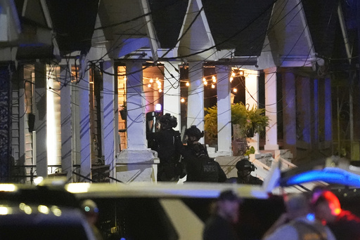 FILE - Louisiana state police enter a house on North Galvez street as they pursue a fugitive that escaped from a New Orleans jail, Tuesday, May 20, 2025, in New Orleans. (AP Photo/Gerald Herbert, File)