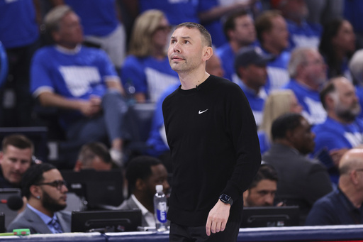 Denver Nuggets head coach David Adelman walks along the bench area late in the second half of Game 5 of an NBA basketball second-round playoff series against the Oklahoma City Thunder Tuesday, May 13, 2025, in Oklahoma City. (AP Photo/Nate Billings)