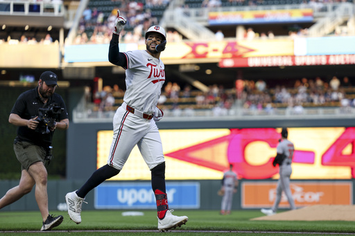 Minnesota Twins shortstop Carlos Correa (4) celebrates after hitting a home run during the third inning of a baseball game against the Baltimore Orioles Tuesday, May 6, 2025, in Minneapolis, Minn. (AP Photo/Ellen Schmidt)