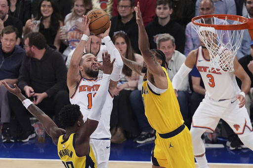New York Knicks guard Jalen Brunson (11) puts up a shot against Indiana Pacers forward Obi Toppin (1) and guard Bennedict Mathurin (00) during the third quarter of Game 5 of the NBA basketball Eastern Conference final, Thursday, May 29, 2025, in New York. (AP Photo/Frank Franklin II)