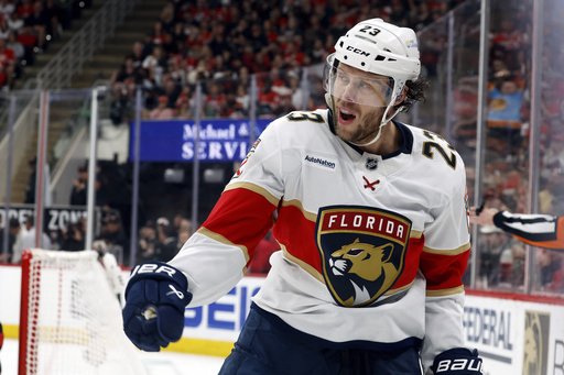 Florida Panthers' Carter Verhaeghe (23) celebrates his goal against the Carolina Hurricanes during first period of Game 1 of the NHL hockey Stanley Cup Eastern Conference finals in Raleigh, N.C., Tuesday, May 20, 2025. (AP Photo/Karl DeBlaker)