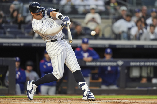 New York Yankees' Aaron Judge hits a single during the fourth inning of a baseball game against the Texas Rangers Tuesday, May 20, 2025, in New York. (AP Photo/Frank Franklin II)