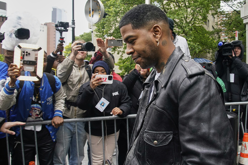 Rapper Kid Cudi leaves federal court after testifying at the trial of Sean "Diddy" Combs in New York, Thursday, May 22, 2025. (AP Photo/Richard Drew)