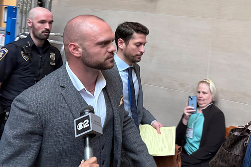Former New York state trooper Thomas Mascia leaves Nassau County court in Mineola, N.Y. on Wednesday, May 21, 2025, after pleading guilty to charges that he shot himself and lied about it. (AP Photo/Philip Marcelo)