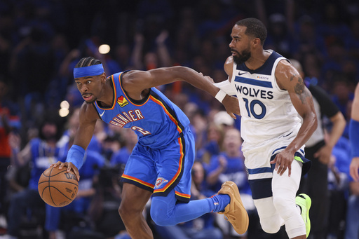 Oklahoma City Thunder guard Shai Gilgeous-Alexander (2) drives against Minnesota Timberwolves guard Mike Conley (10) during the first half of Game 2 of an NBA basketball Western Conference Finals playoff series Thursday, May 22, 2025, in Oklahoma City. (AP Photo/Nate Billings)
