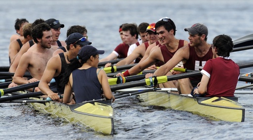 FILE — Members of Yale crew, left, and Harvard crew, right, greet one another after the four-mile course along the Thames River for the 146th Harvard-Yale Regatta, in New London, Conn., Saturday, May 28, 2011. (AP Photo/Jessica Hill, File)