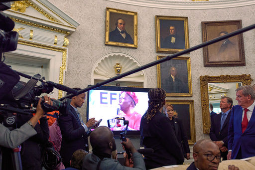 A video plays during a meeting between President Donald Trump and South Africa's President Cyril Ramaphosa in the Oval Office of the White House, Wednesday, May 21, 2025, in Washington. (AP Photo/Evan Vucci)