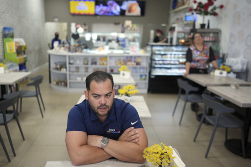 Wilmer Escaray talks about his concerns about the future of his employees and customers during an interview inside a franchise of "Sabor Venezolano," one of 18 businesses he owns which employ scores of Venezuelan immigrants with Temporary Protected Status (TPS) who are now potentially exposed to deportation, in Doral, Fla., Tuesday, May 20, 2025. (AP Photo/Rebecca Blackwell)