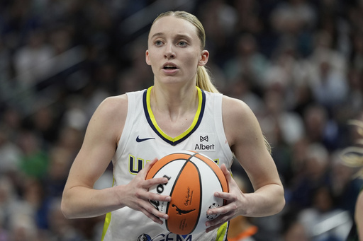 Dallas Wings guard Paige Bueckers (5) looks toward a referee after being called for a foul during the second half of a WNBA basketball game against the Minnesota Lynx, Wednesday, May 21, 2025, in Minneapolis. (AP Photo/Abbie Parr)
