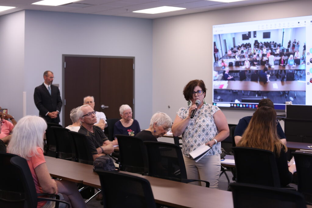 Nikki Gronli, former USDA Rural Development state director, speaks at a state Department of Social Services public hearing regarding cuts to TANF benefits at the Sioux Falls One Stop on June 20, 2025. (Makenzie Huber/South Dakota Searchlight)