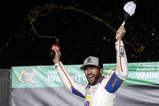 Driver Chase Elliott celebrates in Victory Lane after winning a NASCAR Cup Series auto race, Saturday, June 28, 2025, in Hampton, Ga. (AP Photo/Butch Dill)