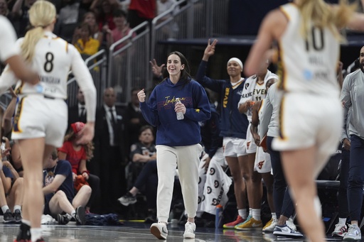 Indiana Fever's Caitlin Clark reacts during the first half in a WNBA basketball game against the Los Angeles Sparks, Thursday, June 26, 2025, in Indianapolis. (AP Photo/Michael Conroy)