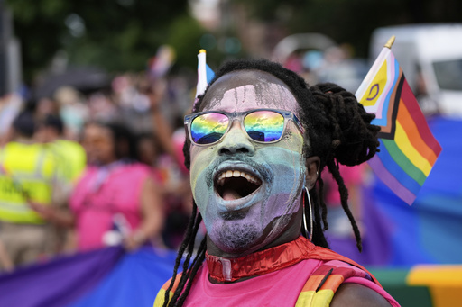 A person attends the World Pride parade, Saturday, June 7, 2025, in Washington. (AP Photo/Alex Brandon)
