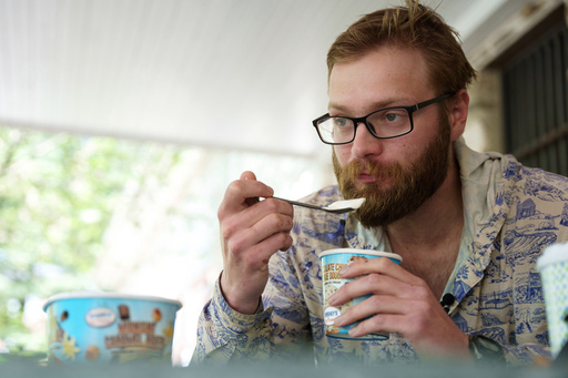 Appalachian Trail thru-hiker Sam Cooper, trail name Pie Top, attempts the half-gallon ice cream challenge at Pine Grove Furnace State Park in Pennsylvania on Tuesday, June 10, 2025. (AP Photo/Mingson Lau)