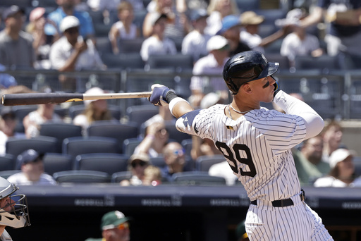 New York Yankees' Aaron Judge hits a two-run home run during the fourth inning of a baseball game against the Athletics, Sunday, June 29, 2025, in New York. (AP Photo/Adam Hunger)