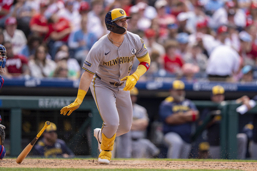 Milwaukee Brewers' Jake Bauers hits a two-run double during the seventh inning of a baseball game against the Philadelphia Phillies, Sunday, June 1, 2025, in Philadelphia. (AP Photo/Chris Szagola)