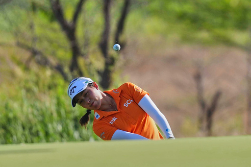 CORRECTS FIRST NAME TO JEENO, NOT JEAN - Jeeno Thitikul hits on the first hole during the first round of the Women's PGA Championship golf tournament, Thursday, June 19, 2025, in Frisco, Texas. (AP Photo/LM Otero)