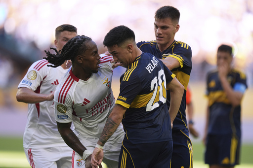 Benfica's Renato Sanches, left, and Boca Juniors' Alan Velasco confront each other during the Club World Cup group C soccer match between Boca Juniors and Benfica in Miami Gardens, Fla., Monday, June 16, 2025. (AP Photo/Rebecca Blackwell)