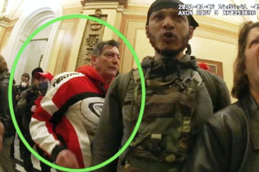 This image from the Department of Justice statement of facts to support an arrest warrant for David Walls-Kaufman, shows an image from police body-worn video, contained and annotated by the source, of David Walls-Kaufman in the U.S. Capitol Jan. 6, 2021, in Washington. (Department of Justice via AP)