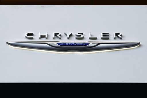 FILE - The Chrysler logo is on display at the Pittsburgh International Auto Show, Feb. 11, 2016, in Pittsburgh. (AP Photo/Gene J. Puskar, File)