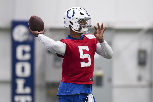 Indianapolis Colts quarterback Anthony Richardson Sr. (5) throws during practice at the NFL football team's training facility in Indianapolis, Wednesday, May 28, 2025. (AP Photo/Michael Conroy)