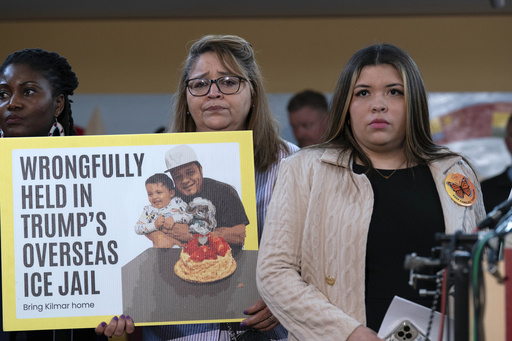 FILE - Jennifer Vasquez Sura, the wife of Kilmar Abrego Garcia of Maryland, who was mistakenly deported to El Salvador, right, stands with supporters during a news conference at CASA's Multicultural Center in Hyattsville, Md., April 4, 2025. (AP Photo/Jose Luis Magana, FIle)
