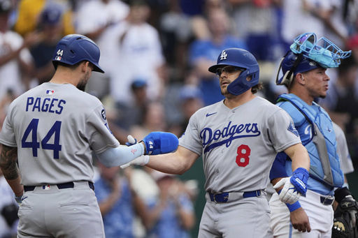 Los Angeles Dodgers' Kike Hernandez (8) celebrates with Andy Pages (44) after hitting a two-run home run during the second inning of a baseball game against the Kansas City Royals, Sunday, June 29, 2025, in Kansas City, Mo. (AP Photo/Charlie Riedel)