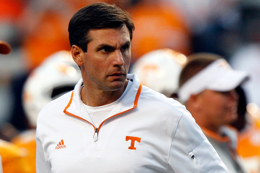 FILE - Tennessee Volunteers head coach Derek Dooley watches his team warm up before an NCAA college football game on Sept. 22, 2012, in Knoxville, Tenn. (AP Photo/Wade Payne, File)