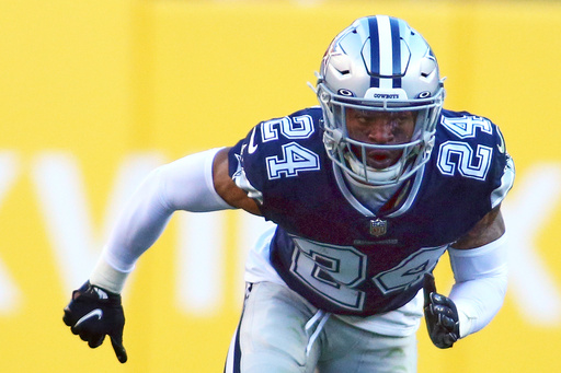 FILE - Dallas Cowboys cornerback Kelvin Joseph (24) runs during an NFL football game against the Washington Football Team, Dec. 12, 2021 in Landover. (AP Photo/Daniel Kucin Jr., File)