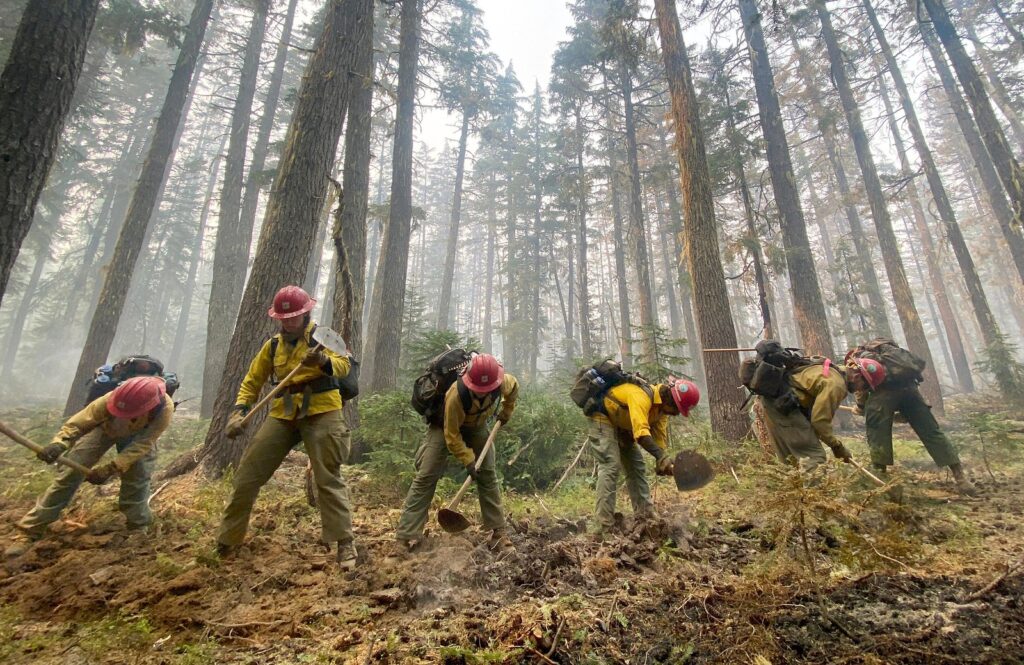 Federal firefighters digging a fire line. (Courtesy of National Interagency Fire Center)