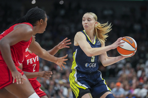 Dallas Wings guard Paige Bueckers works the floor against the Indiana Fever during the first half of a WNBA basketball game Friday, June 27, 2025, in Dallas. (AP Photo/Julio Cortez)