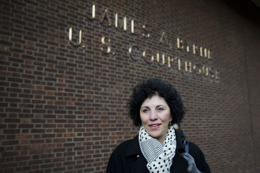 FILE - Eleanor Perfetto widow of NFL player Ralph Wenzel leaves the U.S. Courthouse after a hearing on the proposed NFL concussion settlement Wednesday, Nov. 19, 2014, in Philadelphia. (AP Photo/Matt Rourke, file)