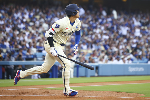 Los Angeles Dodgers designated hitter Shohei Ohtani runs after hitting a home run during the first inning of a baseball game against the San Francisco Giants in Los Angeles, Saturday, June 14, 2025. (AP Photo/Jessie Alcheh)