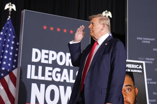 FILE - Republican presidential nominee former President Donald Trump salutes at a campaign rally at the Gaylord Rockies Resort & Convention Center, Oct. 11, 2024, in Aurora, Colo. (AP Photo/Alex Brandon, File)
