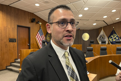 Douglas County Board Chairman Roger Garcia, whose district includes the south Omaha area where federal immigration officials raided a meat packaging plant on Tuesday, June 10, 2025, addresses reporters on Wednesday, June 11, in Omaha, Neb. Garcia says his community, which includes a large immigrant population, is shaken by the raid, and noted that his wife's aunt was among those arrested and taken away from Glenn Valley Foods. (AP Photo/Margery Beck)