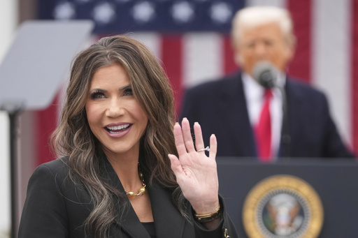 FILE - Homeland Security Secretary Kristi Noem is recognized as President Donald Trump speaks during an event to announce new tariffs in the Rose Garden at the White House, April 2, 2025, in Washington. (AP Photo/Mark Schiefelbein, File)