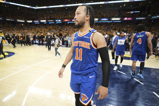 New York Knicks guard Jalen Brunson (11) reacts after losing to the Indiana Pacers in Game 6 of the Eastern Conference finals of the NBA basketball playoffs in Indianapolis, Saturday, May 31, 2025. (AP Photo/Michael Conroy)